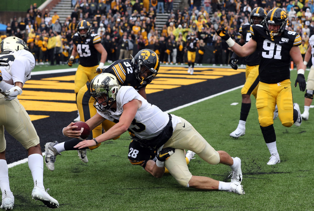 Iowa Hawkeyes linebacker Djimon Colbert (32) and defensive back Jack Koerner (28) against the Purdue Boilermakers Saturday, October 19, 2019 at Kinnick Stadium. (Brian Ray/hawkeyesports.com)