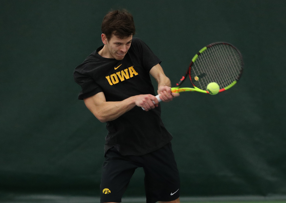 Iowa's Piotr Smietana against UMKC Friday, February 15, 2019 at the Hawkeye Tennis and Recreation Complex. (Brian Ray/hawkeyesports.com)