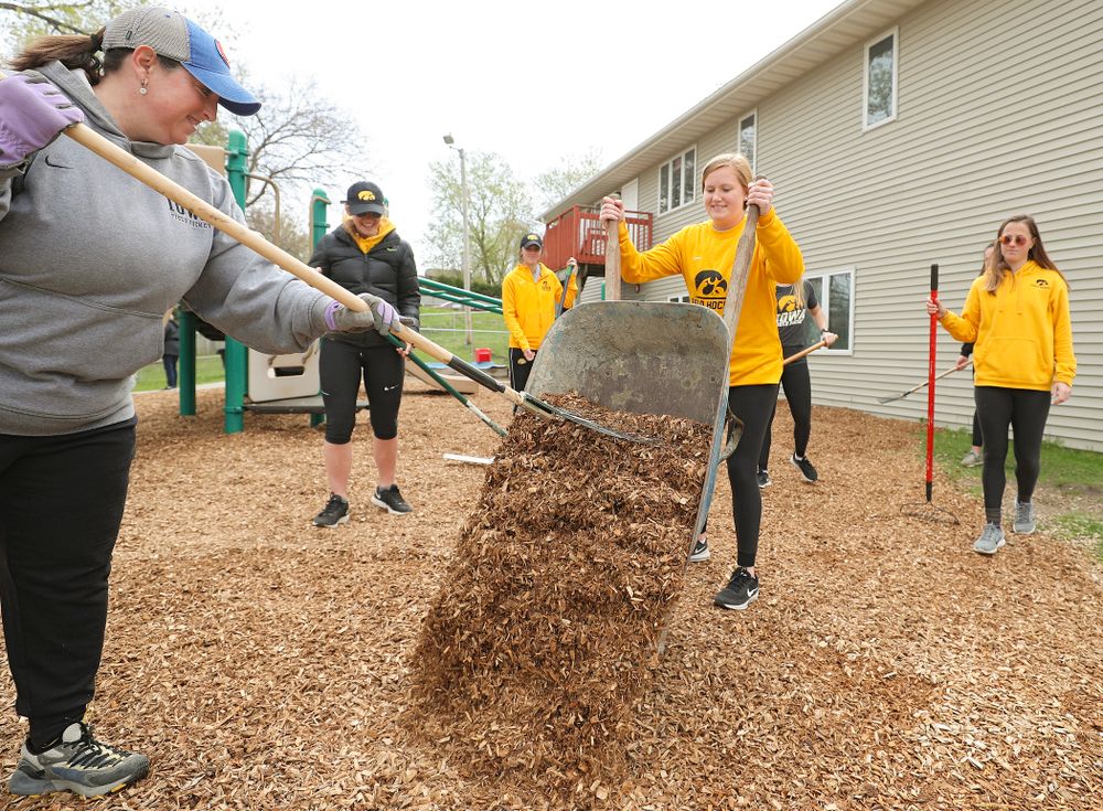 Iowa field hockey players re-mulch the playground at the HACAP Coral Ridge Head Start Center during the 21st annual ISAAC Hawkeye Day of Caring in Coralville on Sunday, Apr. 28, 2019. (Stephen Mally/hawkeyesports.com)