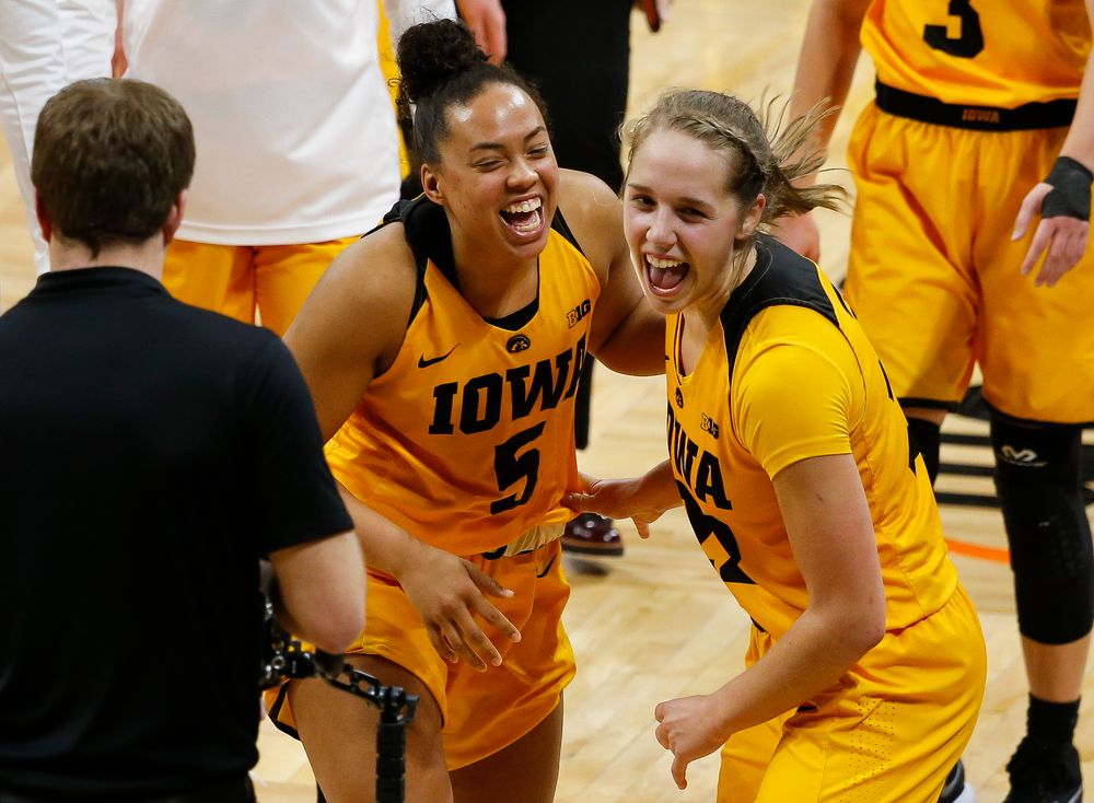 Iowa Hawkeyes guard Alexis Sevillian (5) and Iowa Hawkeyes guard Kathleen Doyle (22) celebrate after a game against the Ohio State Buckeyes at Carver-Hawkeye Arena on January 25, 2018. (Tork Mason/hawkeyesports.com)