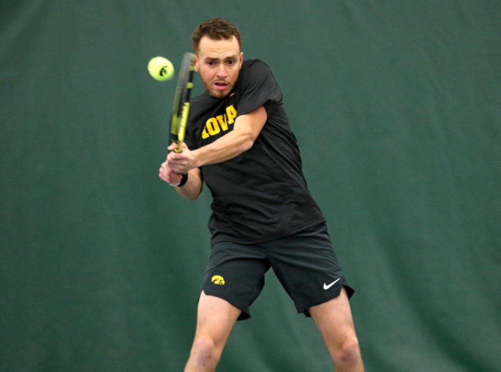 Iowa’s Kareem Allaf returns a shot during his doubles match at the Hawkeye Tennis and Recreation Complex in Iowa City on Thursday, January 16, 2020. (Stephen Mally/hawkeyesports.com)
