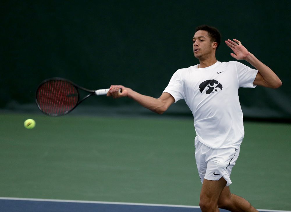 Iowa’s Oliver Okonkwo against Cornell Sunday, March 8, 2020 at the Hawkeye Tennis and Recreation Center. (Brian Ray/hawkeyesports.com)