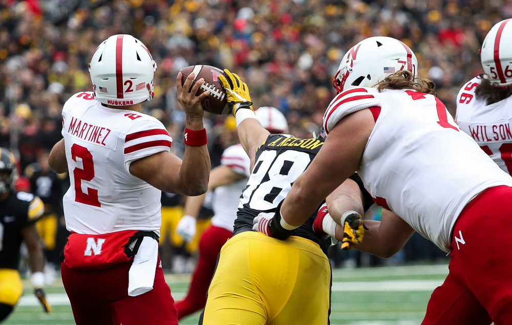 Iowa Hawkeyes defensive end Anthony Nelson (98) knocks the ball out of the quarterback's hand during a game against Nebraska at Kinnick Stadium on November 23, 2018. (Tork Mason/hawkeyesports.com)