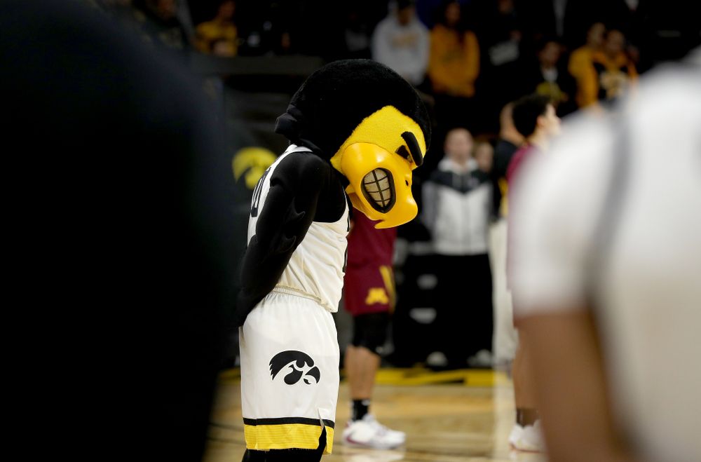 Herky The Hawk bows his head during a moment of silence for former University of Iowa Director of Athletics Bump Elliott before the Iowa Hawkeyes game against the Minnesota Golden Gophers Monday, December 9, 2019 at Carver-Hawkeye Arena. (Brian Ray/hawkeyesports.com)
