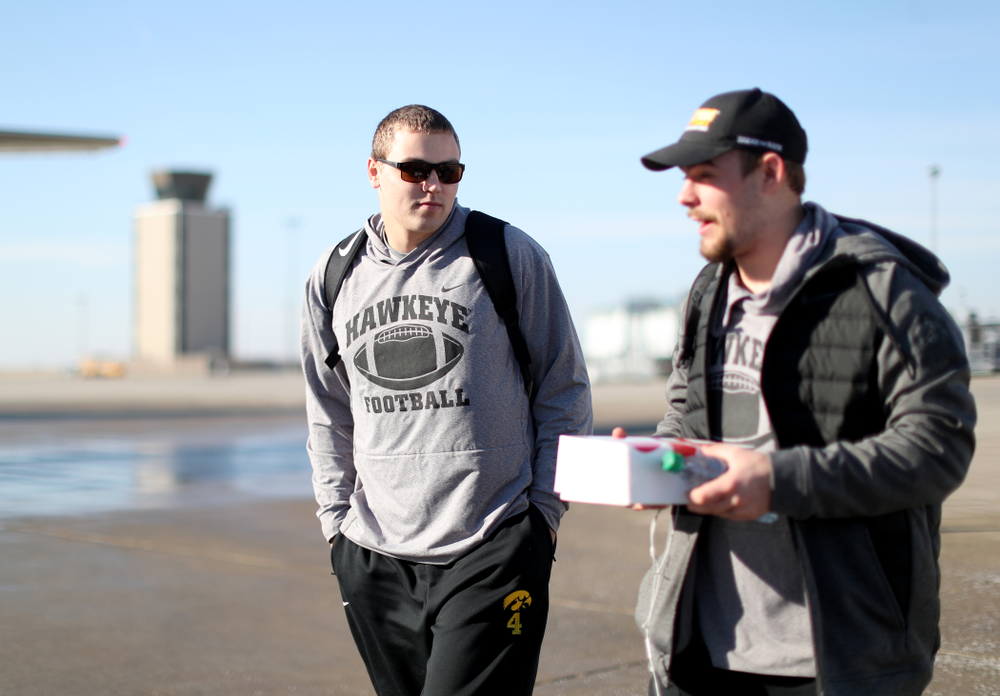 Iowa Hawkeyes quarterback Nate Stanley (4) boards the team plane at the Eastern Iowa Airport Saturday, December 21, 2019 on the way to San Diego, CA for the Holiday Bowl. (Brian Ray/hawkeyesports.com)