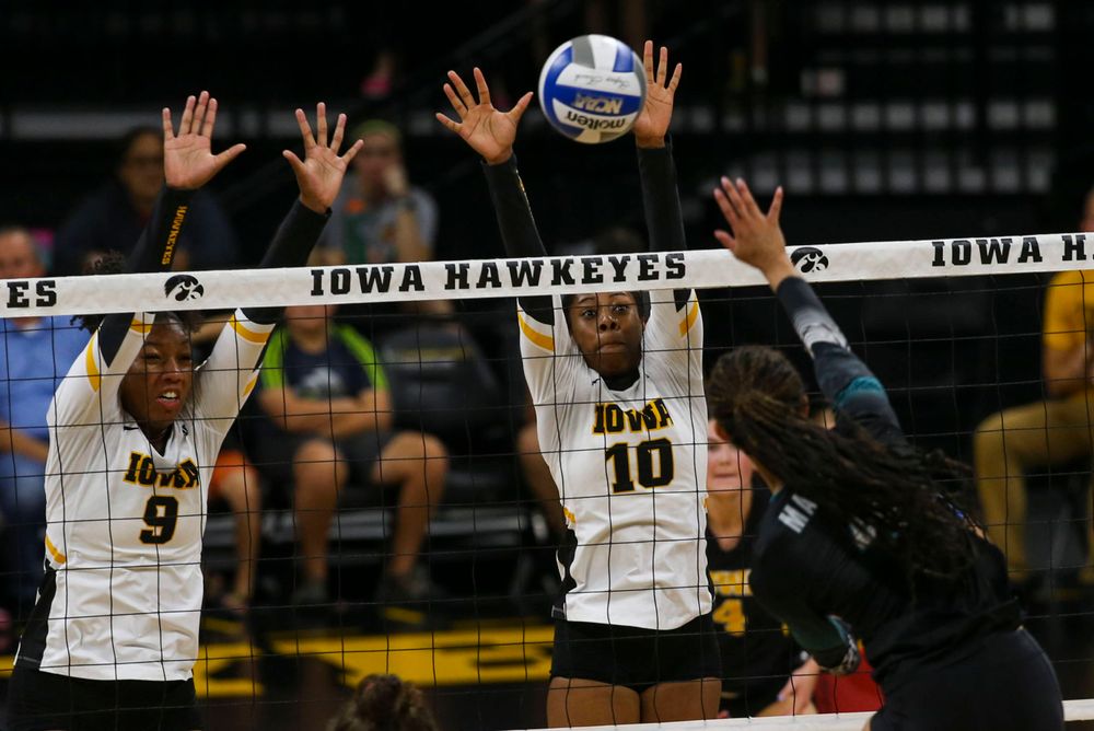Iowa Hawkeyes middle blocker Amiya Jones (9) and Iowa Hawkeyes outside hitter Griere Hughes (10) against Coastal Carolina Friday, September 20, 2019 at Carver-Hawkeye Arena. (Lily Smith/hawkeyesports.com)