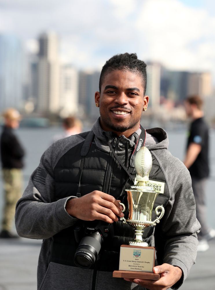 Iowa Hawkeyes defensive back Devonte Young (17) revives the U.S. Grant Sharp AdmiralÕs Trophy during tour of the USS Theodore Roosevelt (CVN-71) Tuesday, December 24, 2019 at the Naval Base Coronado. (Brian Ray/hawkeyesports.com)
