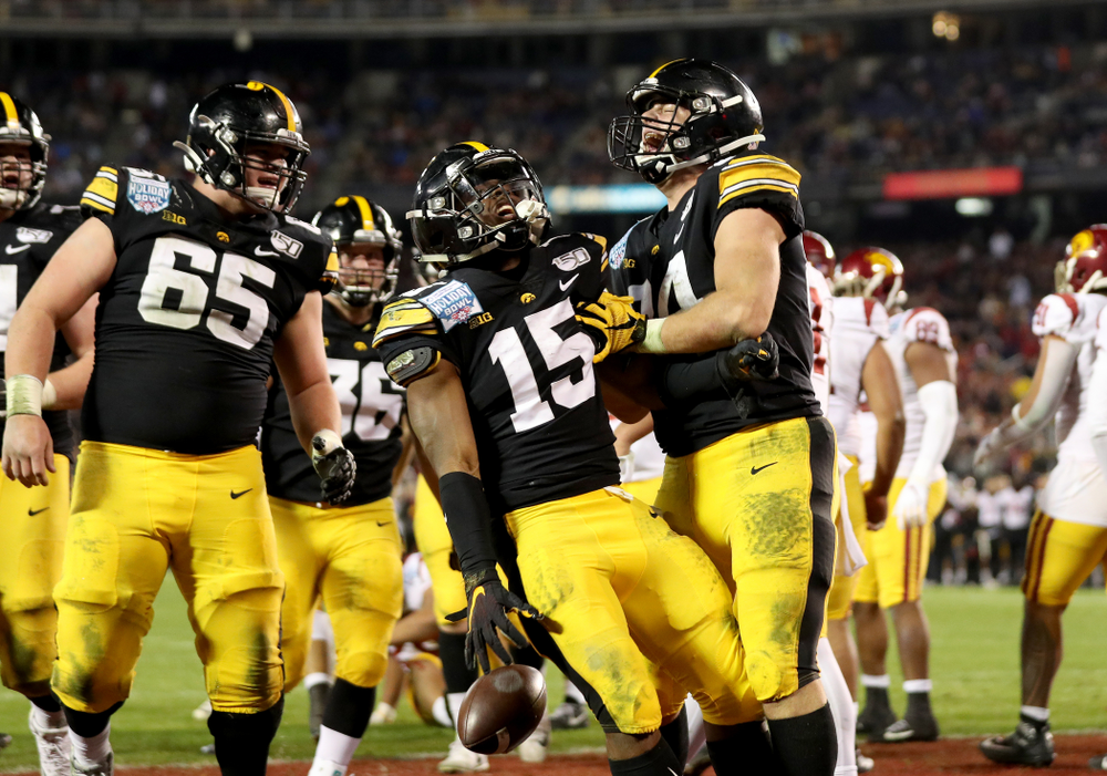 Iowa Hawkeyes running back Tyler Goodson (15) celebrates with tight end Sam LaPorta (84) after scoring against USC in the Holiday Bowl Friday, December 27, 2019 at San Diego Community Credit Union Stadium. (Brian Ray/hawkeyesports.com)