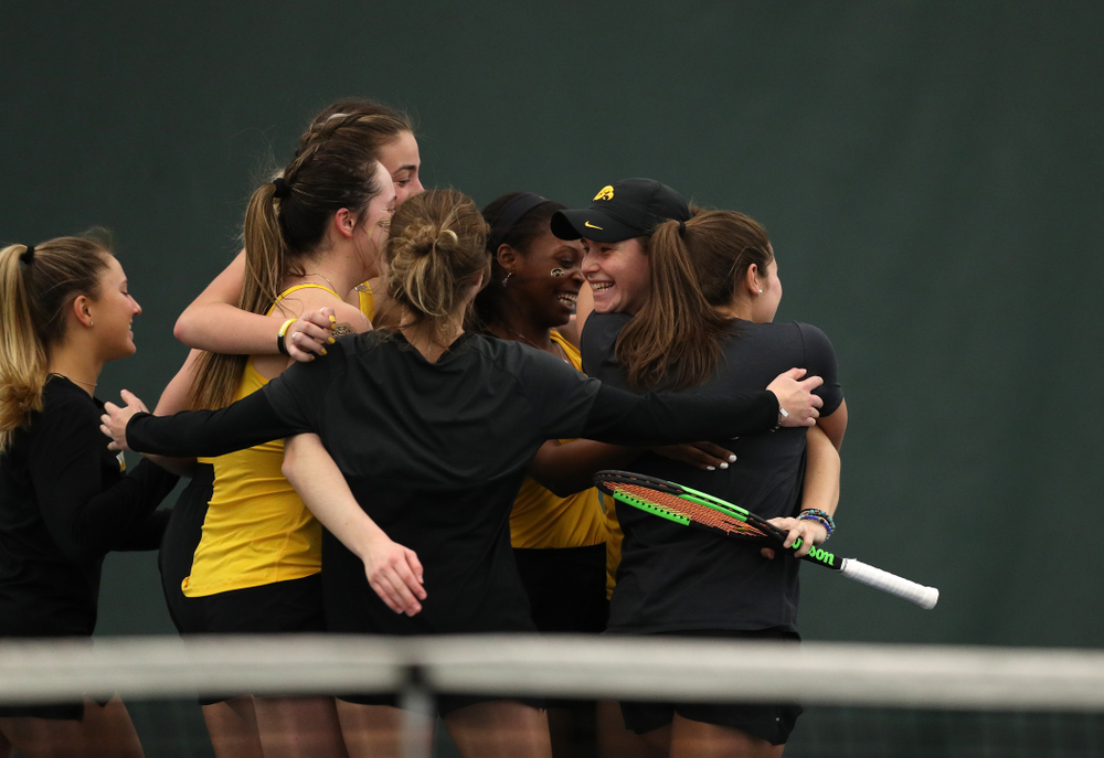 Iowa's Elise Van Heuvelen celebrates with her teammates following their 4-1 win over the Iowa State Cyclones Friday, February 8, 2019 at the Hawkeye Tennis and Recreation Complex. (Brian Ray/hawkeyesports.com)