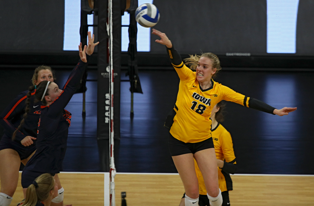 Iowa’s Hannah Clayton (18) gets a kill during the second set of their match against Illinois at Carver-Hawkeye Arena in Iowa City on Wednesday, Nov 6, 2019. (Stephen Mally/hawkeyesports.com)