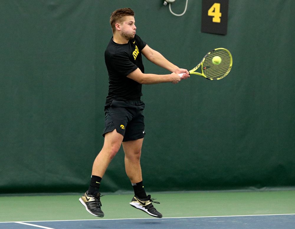 Iowa’s Will Davies returns a shot during his singles match at the Hawkeye Tennis and Recreation Complex in Iowa City on Friday, February 14, 2020. (Stephen Mally/hawkeyesports.com)