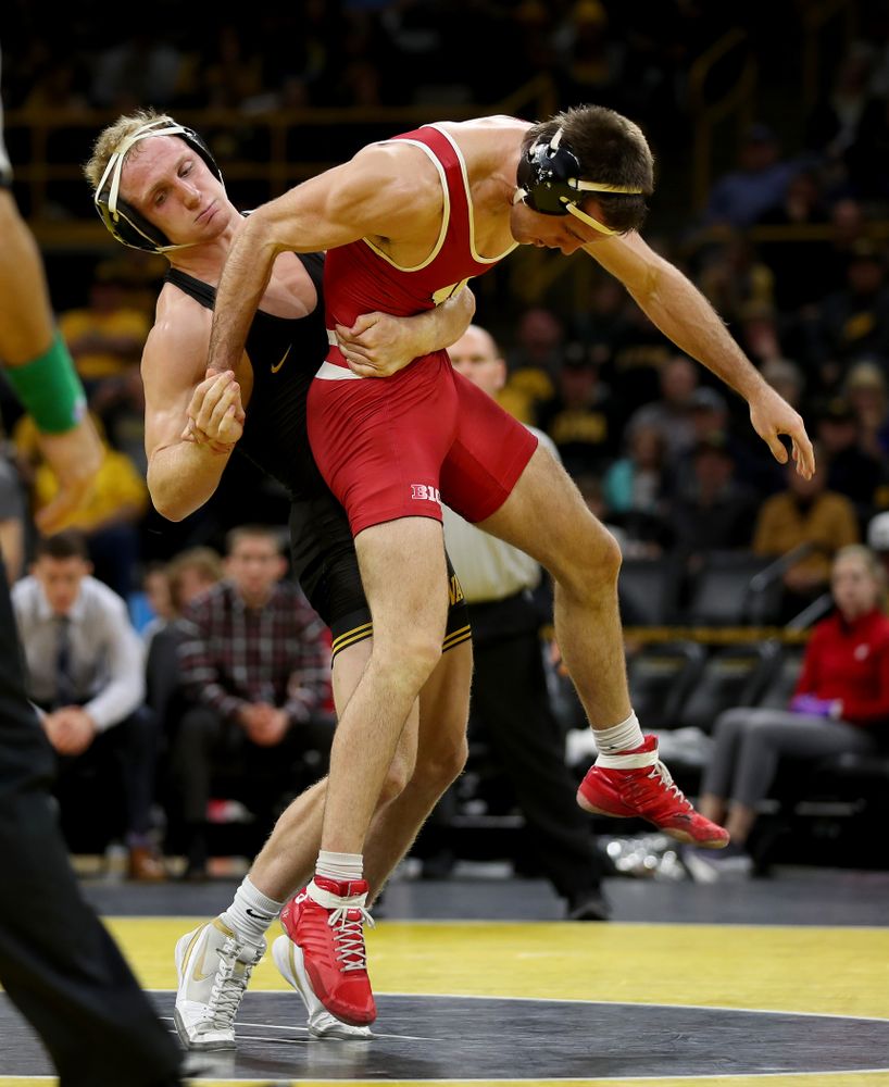 IowaÕs Kaleb Young wrestles WisconsinÕs Garrett Model at 157 pounds Sunday, December 1, 2019 at Carver-Hawkeye Arena. Young won the match 12-6. (Brian Ray/hawkeyesports.com)