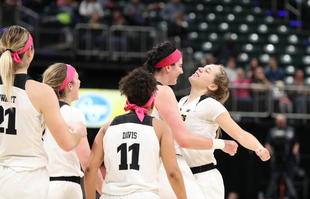 Iowa Hawkeyes forward Megan Gustafson (10) and guard Kathleen Doyle (22) against the Rutgers Scarlet Knights in the semi-finals of the Big Ten Tournament Saturday, March 9, 2019 at Bankers Life Fieldhouse in Indianapolis, Ind. (Brian Ray/hawkeyesports.com)