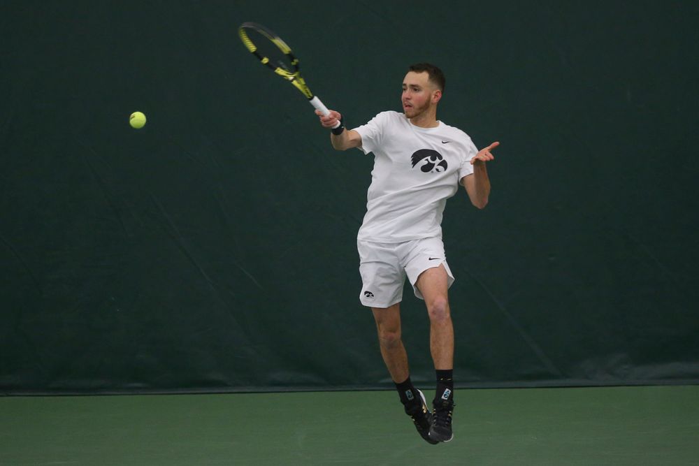 Iowa’s Kareem Allaf returns a hit during the Iowa men’s tennis meet vs Nebraska on Sunday, March 1, 2020 at the Hawkeye Tennis and Recreation Complex. (Lily Smith/hawkeyesports.com)