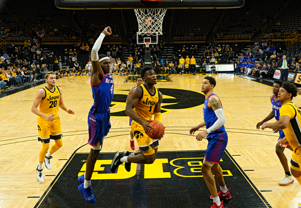 Iowa Hawkeyes guard Joe Toussaint (1) drives into the paint during the second half of their game at Carver-Hawkeye Arena in Iowa City on Monday, Nov 11, 2019. (Stephen Mally/hawkeyesports.com)