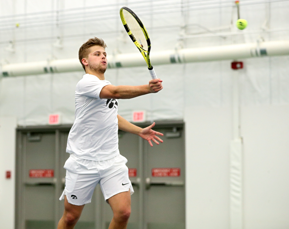 Iowa’s Will Davies returns a shot during his singles match at the Hawkeye Tennis and Recreation Complex in Iowa City on Sunday, February 16, 2020. (Stephen Mally/hawkeyesports.com)