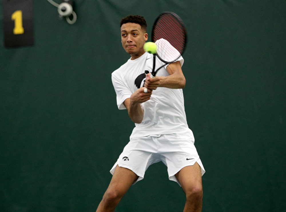 Iowa’s Oliver Okonkwo returns a shot during his doubles match at the Hawkeye Tennis and Recreation Complex in Iowa City on Sunday, February 16, 2020. (Stephen Mally/hawkeyesports.com)