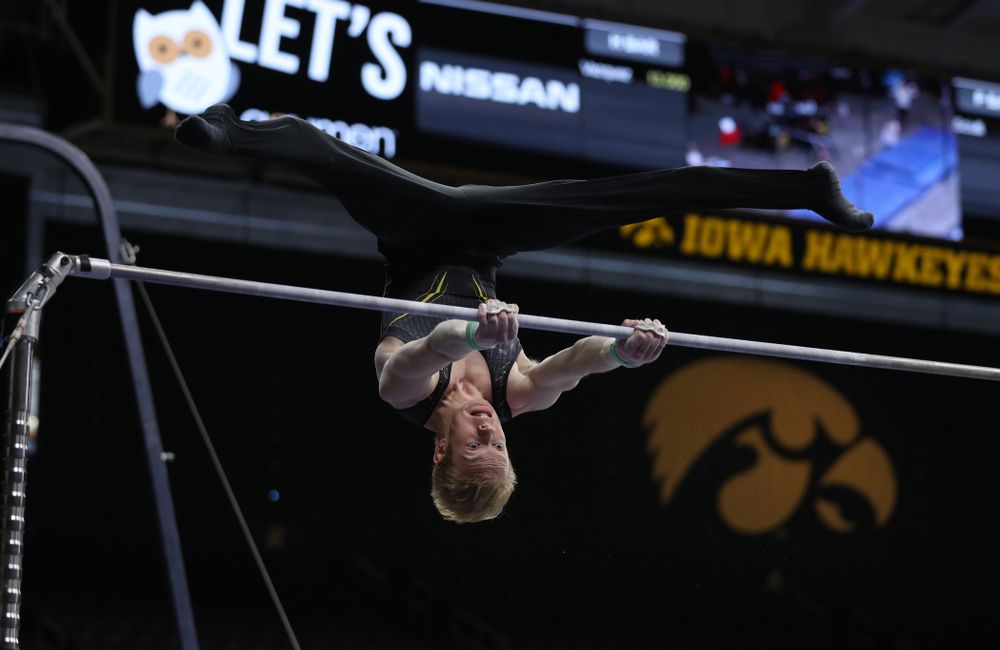 Iowa's Nick Merryman competes on the high bar against the Ohio State Buckeyes Saturday, March 16, 2019 at Carver-Hawkeye Arena. (Brian Ray/hawkeyesports.com)