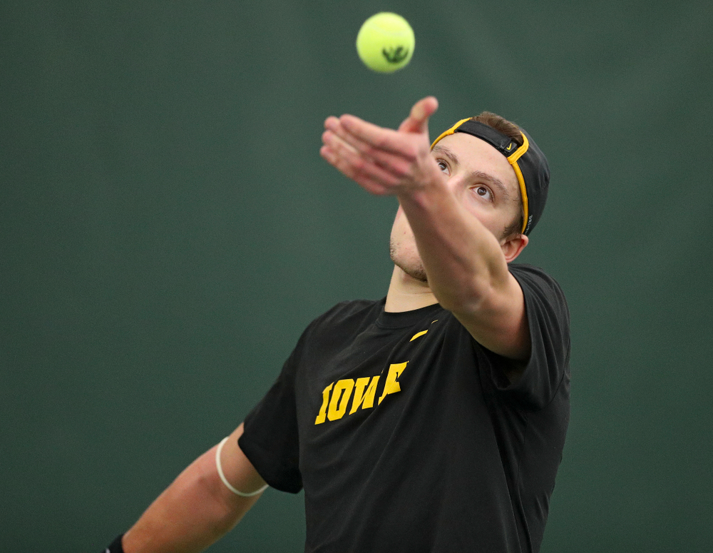 Iowa’s Joe Tyler serves during his match against Marquette at the Hawkeye Tennis and Recreation Complex in Iowa City on Saturday, January 25, 2020. (Stephen Mally/hawkeyesports.com)