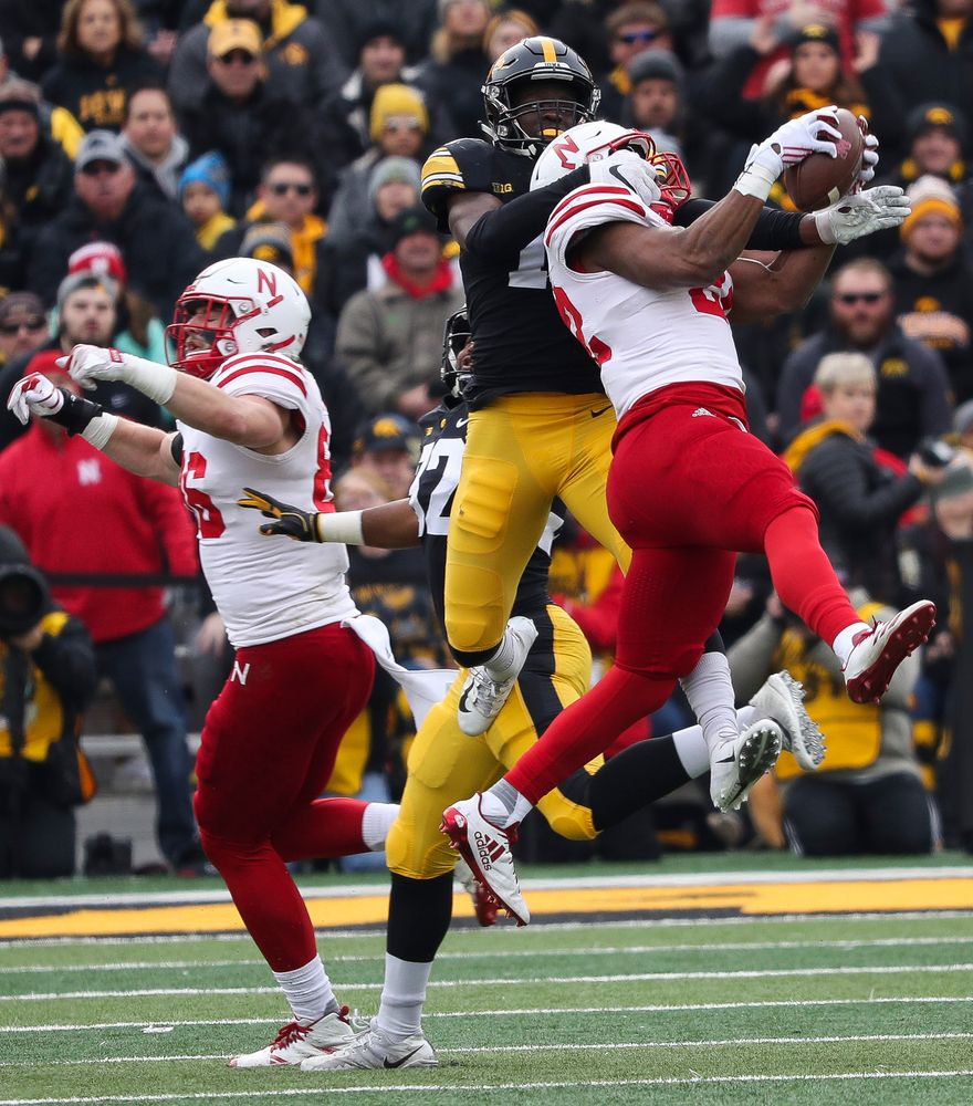 Iowa Hawkeyes defensive back Michael Ojemudia (11) breaks up a pass during a game against Nebraska at Kinnick Stadium on November 23, 2018. (Tork Mason/hawkeyesports.com)