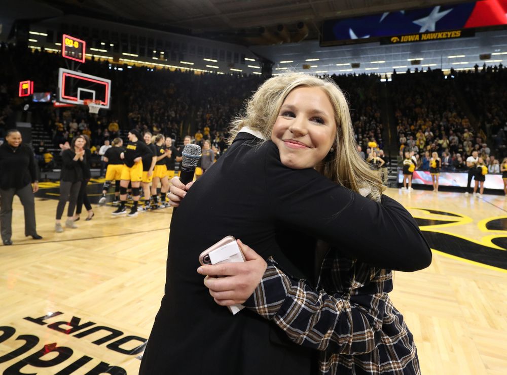 Iowa Hawkeyes head coach Lisa Bluder watches as her daughter Emma sings the National Anthem before the Iowa Hawkeyes game against the Northwestern Wildcats Sunday, March 3, 2019 at Carver-Hawkeye Arena. (Brian Ray/hawkeyesports.com)
