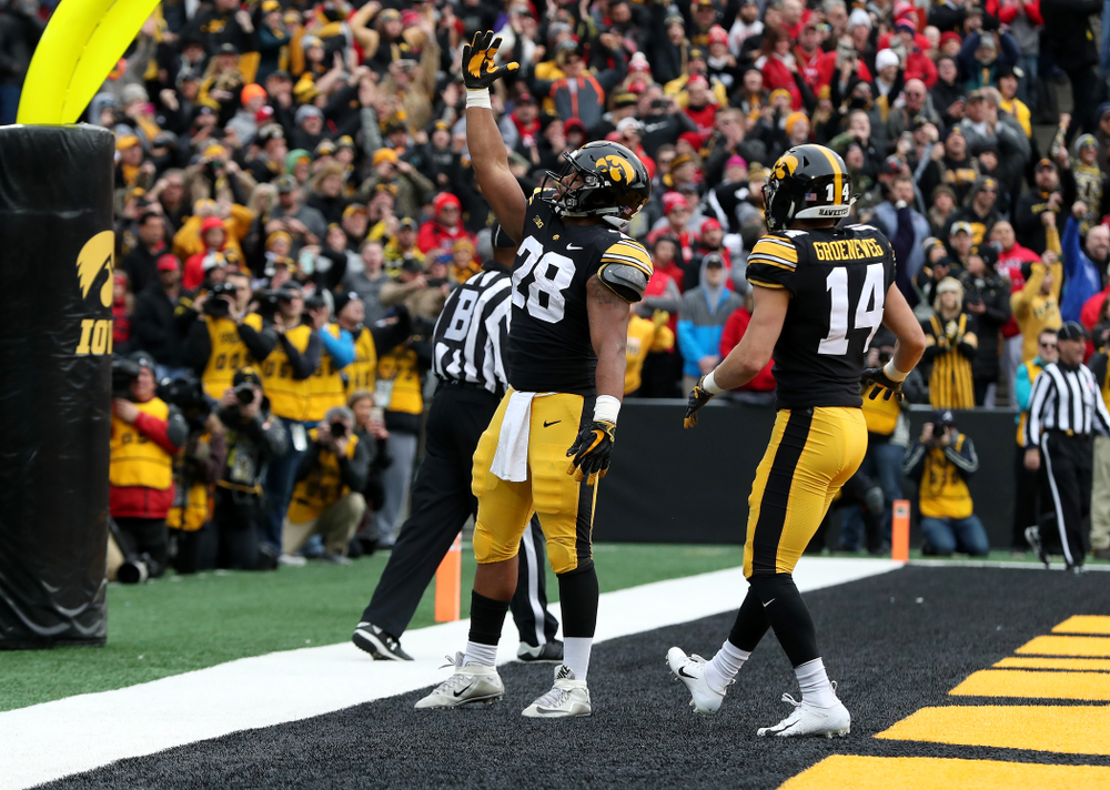 Iowa Hawkeyes running back Toren Young (28) blows a kiss to the fans after scoring against the Nebraska Cornhuskers Friday, November 23, 2018 at Kinnick Stadium. (Brian Ray/hawkeyesports.com)