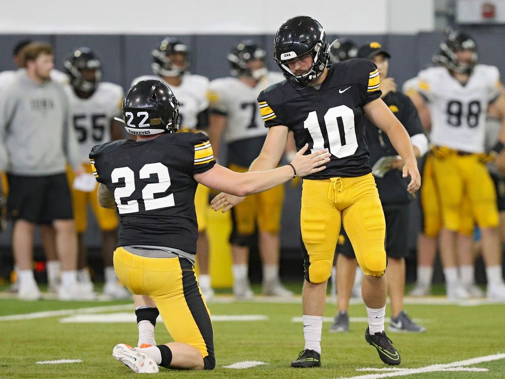 Iowa Hawkeyes’ Michael Sleep-Dalton (22) slaps hands with place kicker Caleb Shudak (10) after a field goal during Fall Camp Practice No. 6 at the Hansen Football Performance Center in Iowa City on Thursday, Aug 8, 2019. (Stephen Mally/hawkeyesports.com)