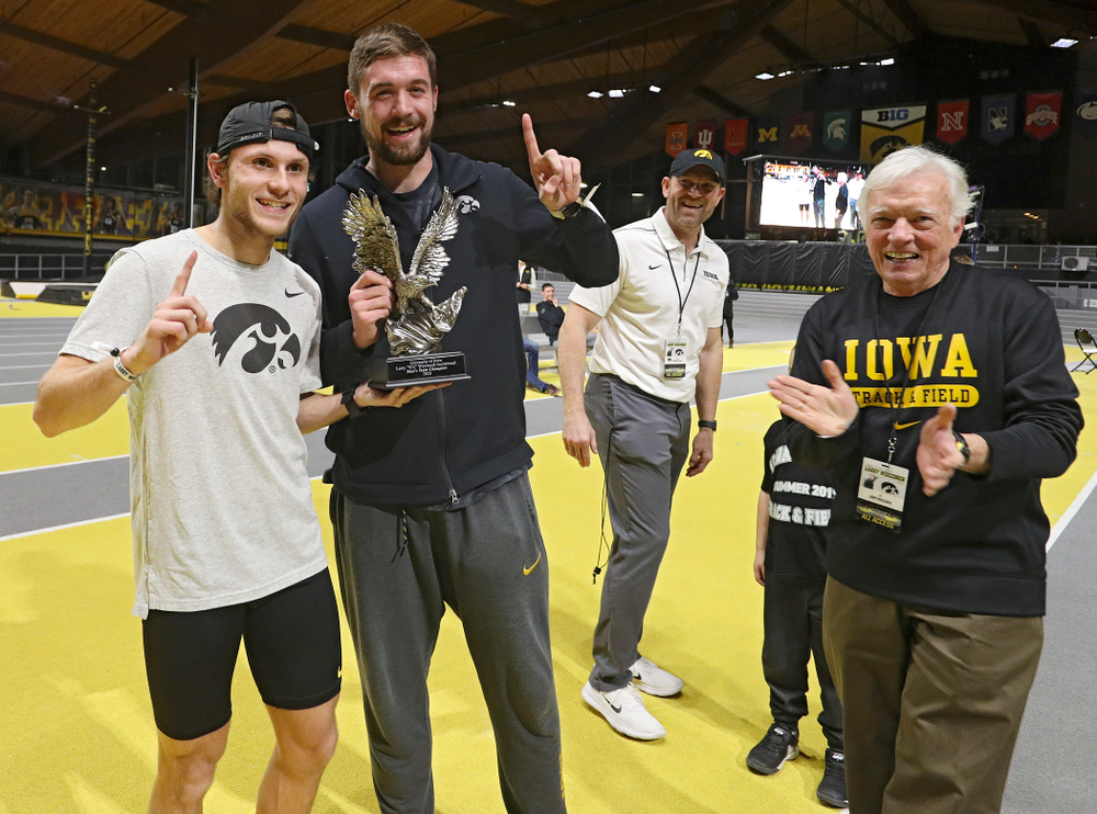 Larry Wieczorek (right) presents the men’s team award to Iowa’s Tysen VanDraska (left) and Nolan Teubel during the Larry Wieczorek Invitational at the Recreation Building in Iowa City on Saturday, January 18, 2020. (Stephen Mally/hawkeyesports.com)