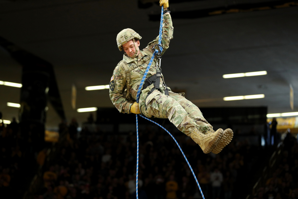 Members of the Iowa Army and Air Force ROTC rappel down from the rafters before the Iowa Hawkeyes game against Penn State Saturday, February 29, 2020 at Carver-Hawkeye Arena. (Brian Ray/hawkeyesports.com)