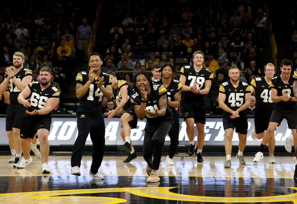 Members of the Hawkeye Football team performs with the Iowa Dance Team at halftime of the Iowa Hawkeyes game against the Ohio State Buckeyes Thursday, February 20, 2020 at Carver-Hawkeye Arena. (Brian Ray/hawkeyesports.com)