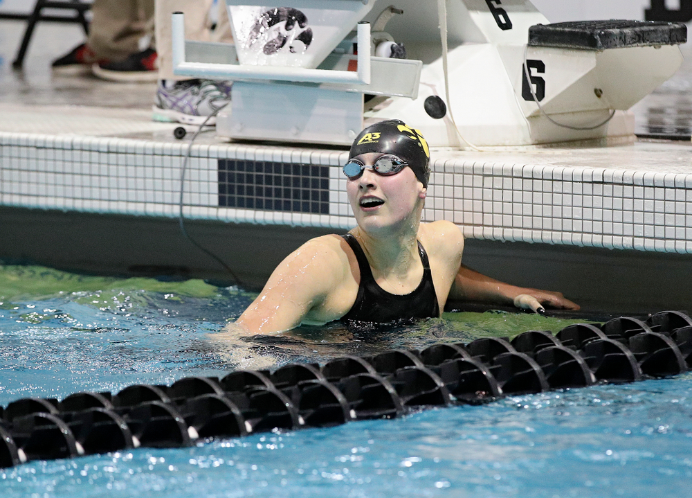 Iowa’s Hannah Burvill reacts as she looks at the video board after swimming the women’s 200 yard freestyle final event during the 2020 Women’s Big Ten Swimming and Diving Championships at the Campus Recreation and Wellness Center in Iowa City on Friday, February 21, 2020. (Stephen Mally/hawkeyesports.com)