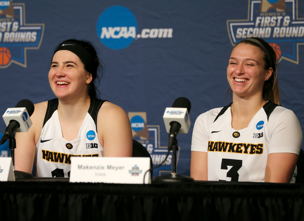 Iowa Hawkeyes forward Megan Gustafson (10) and guard Makenzie Meyer (3) share a laugh as they talk during their press availability after winning their game in the first round of the 2019 NCAA Women's Basketball Tournament at Carver Hawkeye Arena in Iowa City on Friday, Mar. 22, 2019. (Stephen Mally for hawkeyesports.com)