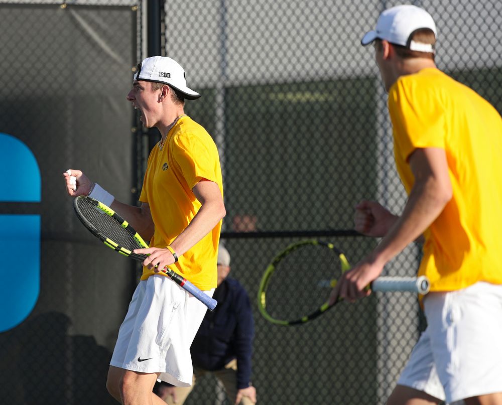 Iowa's Nikita Snezhko (from left) pounds his chest as he celebrates a point with Joe Tyler during their doubles match again Michigan State at the Hawkeye Tennis and Recreation Complex in Iowa City on Friday, Apr. 19, 2019. (Stephen Mally/hawkeyesports.com)