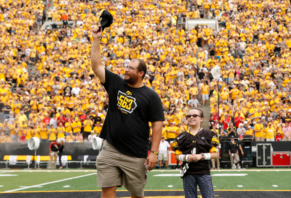 Honorary Captain Julian Vandervelde and the kid captain against the Northern Illinois Huskies Saturday, September 1, 2018 at Kinnick Stadium. (Brian Ray/hawkeyesports.com)