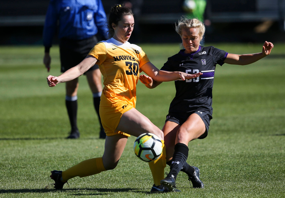 Iowa Hawkeyes forward Devin Burns (30) makes a tackle during a game against Northwestern at the Iowa Soccer Complex on October 21, 2018. (Tork Mason/hawkeyesports.com)