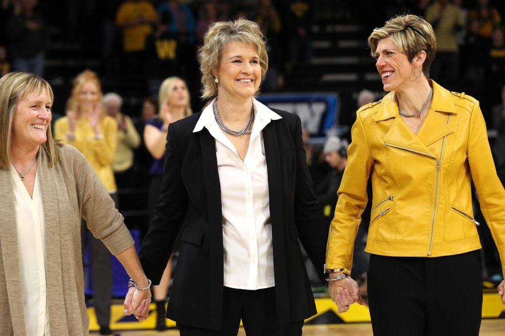 Iowa Hawkeyes head coach Lisa Bluder watches as her daughter Emma sings the National Anthem before the Iowa Hawkeyes game against the Northwestern Wildcats Sunday, March 3, 2019 at Carver-Hawkeye Arena. (Brian Ray/hawkeyesports.com)