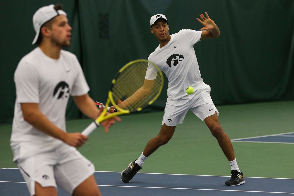 Iowa’s Oliver Okonkwo hits a forehand during the Iowa men’s tennis match vs Western Michigan on Saturday, January 18, 2020 at the Hawkeye Tennis and Recreation Complex. (Lily Smith/hawkeyesports.com)