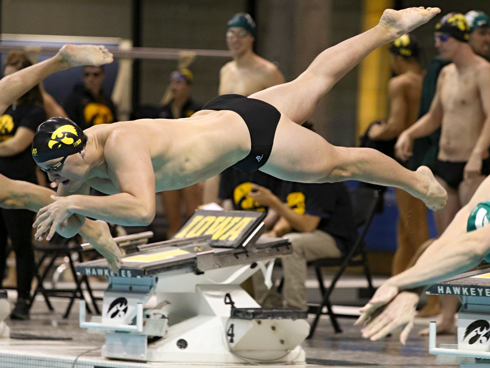 Iowa’s Will Myhre takes off for the 100-yard individual medley event during their meet against Michigan State at the Campus Recreation and Wellness Center in Iowa City on Thursday, Oct 3, 2019. (Stephen Mally/hawkeyesports.com)