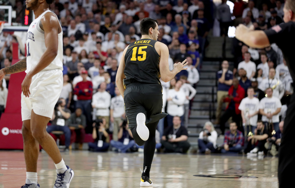 Iowa Hawkeyes forward Ryan Kriener (15) celebrates a three point basket against Penn State Friday, January 3, 2020 at the Palestra in Philadelphia. (Brian Ray/hawkeyesports.com)