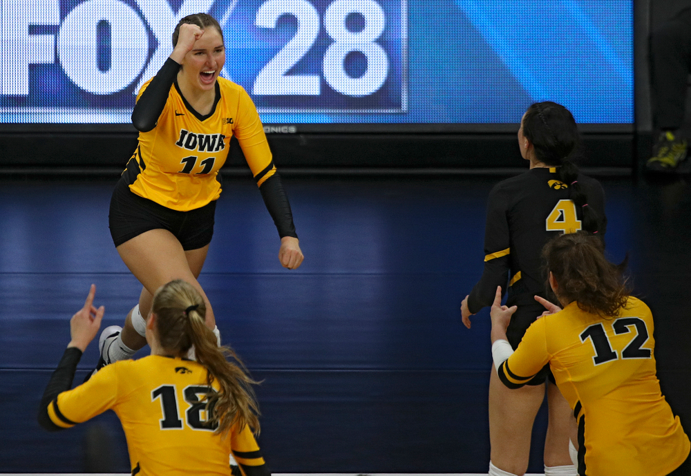 Iowa’s Blythe Rients (11) celebrates her kill during the second set of their match against Illinois at Carver-Hawkeye Arena in Iowa City on Wednesday, Nov 6, 2019. (Stephen Mally/hawkeyesports.com)