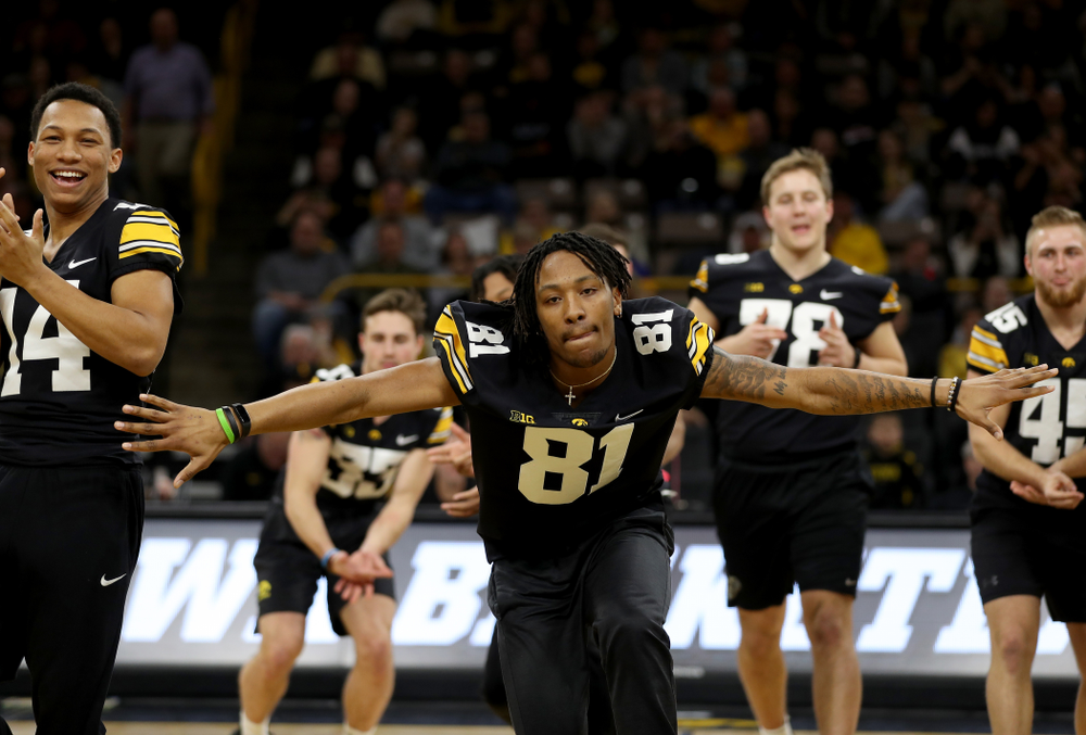 Members of the Hawkeye Football team performs with the Iowa Dance Team at halftime of the Iowa Hawkeyes game against the Ohio State Buckeyes Thursday, February 20, 2020 at Carver-Hawkeye Arena. (Brian Ray/hawkeyesports.com)