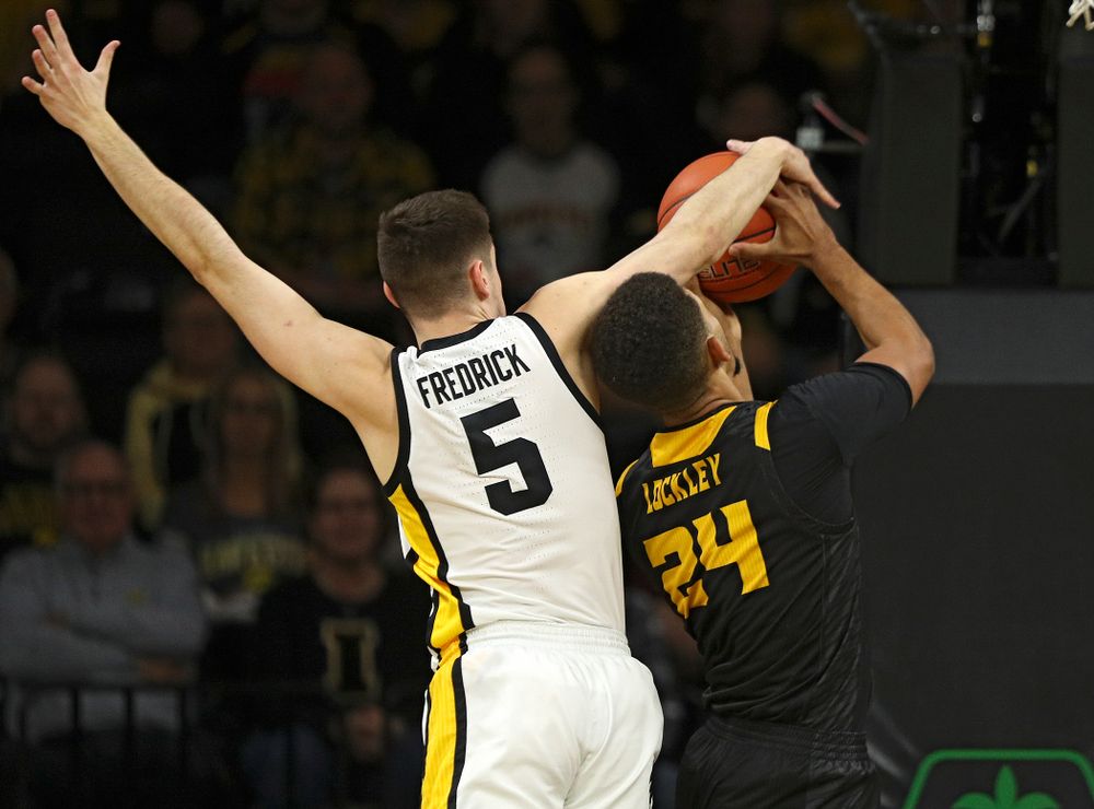 Iowa Hawkeyes guard CJ Fredrick (5) blocks a shot by Kennesaw State Owls forward Bryson Lockley (24) during the first half of their their game at Carver-Hawkeye Arena in Iowa City on Sunday, December 29, 2019. (Stephen Mally/hawkeyesports.com)