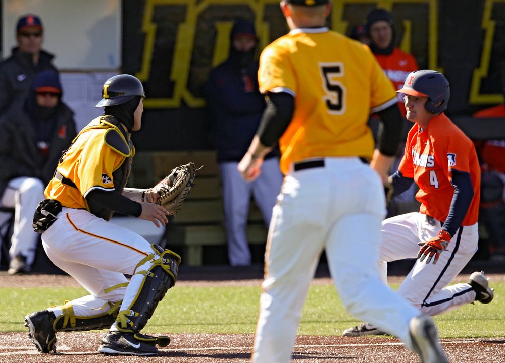 Iowa Hawkeyes catcher Austin Martin (34) tags out the runner at the plate to complete an inning ending double play during the eighth inning against Illinois at Duane Banks Field in Iowa City on Sunday, Mar. 31, 2019. (Stephen Mally/hawkeyesports.com)
