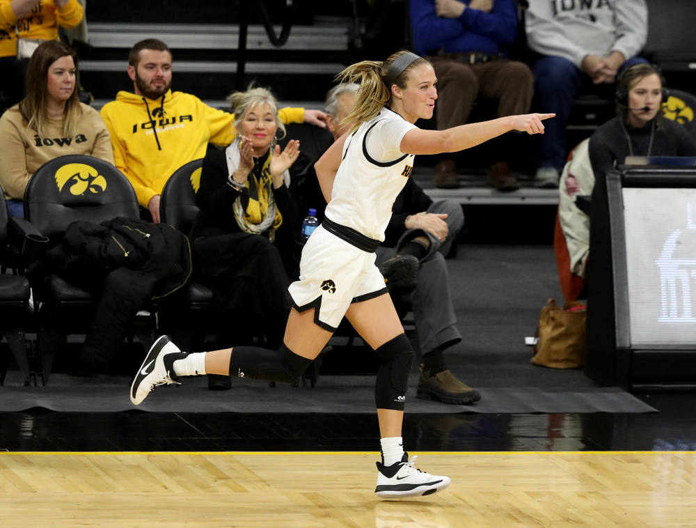Iowa Hawkeyes guard Makenzie Meyer (3) celebrates after making a three point basket on an assistant from guard Megan Meyer (11) against North Carolina Central Saturday, December 14, 2019 at Carver-Hawkeye Arena. (Brian Ray/hawkeyesports.com)
