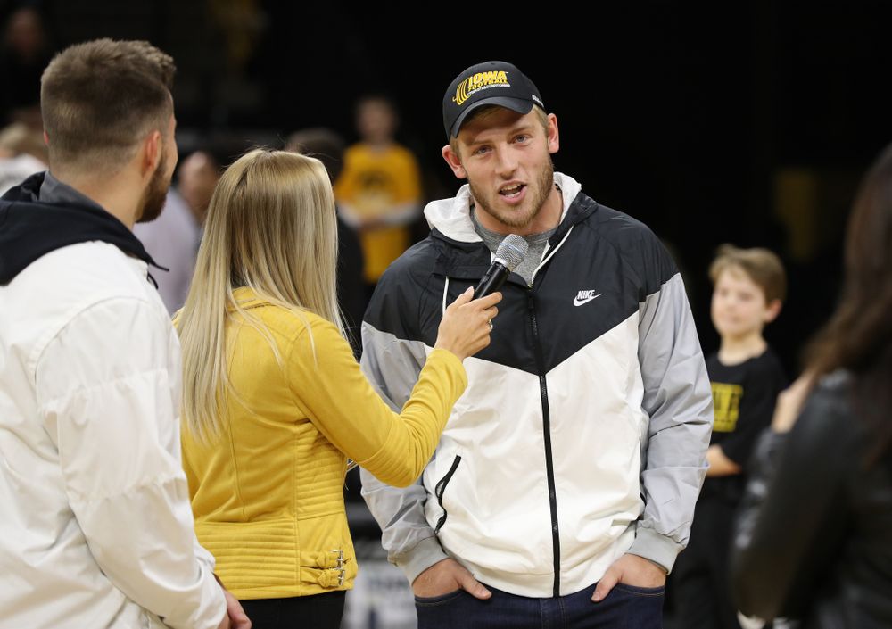 The Hawkeye Football team is introduced during a timeout of the Iowa Hawkeyes game against the Michigan Wolverines Friday, February 1, 2019 at Carver-Hawkeye Arena. (Brian Ray/hawkeyesports.com)