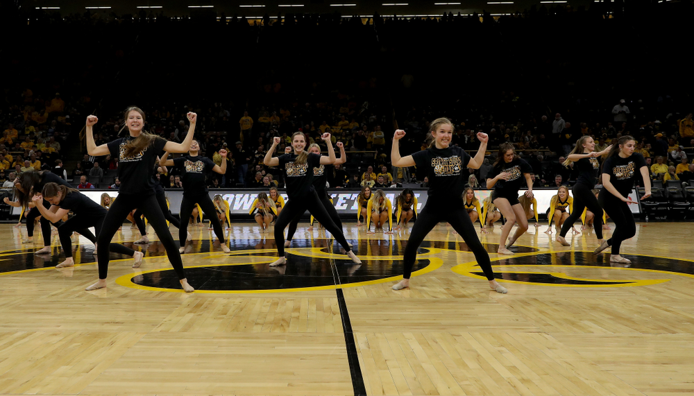 The Iowa Spirit Squad performs with participants in Spirit Squad Day at halftime of the Iowa Hawkeyes game against the Nebraska Cornhuskers Saturday, February 8, 2020 at Carver-Hawkeye Arena. (Brian Ray/hawkeyesports.com)