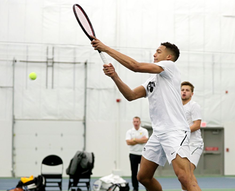 Iowa’s Oliver Okonkwo returns a shot during his doubles match at the Hawkeye Tennis and Recreation Complex in Iowa City on Sunday, February 16, 2020. (Stephen Mally/hawkeyesports.com)