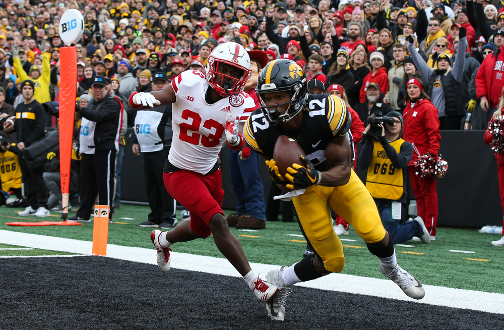 Iowa Hawkeyes wide receiver Brandon Smith (12) makes a touchdown catch during a game against Nebraska at Kinnick Stadium on November 23, 2018. (Tork Mason/hawkeyesports.com)