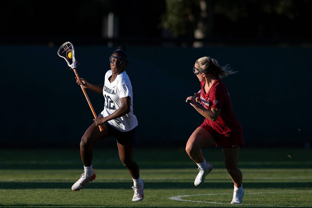 STANFORD, California - FEBRUARY 14: Virginia Cavaliers defense Jalen Knight (12) runs past Stanford Cardinal attack Ali Baiocco (13) during the second half at Cagan Stadium on February 14, 2020 in Stanford, California. The Virginia Cavaliers defeated the Stanford Cardinal 12-11. (Photo by Jason O. Watson)