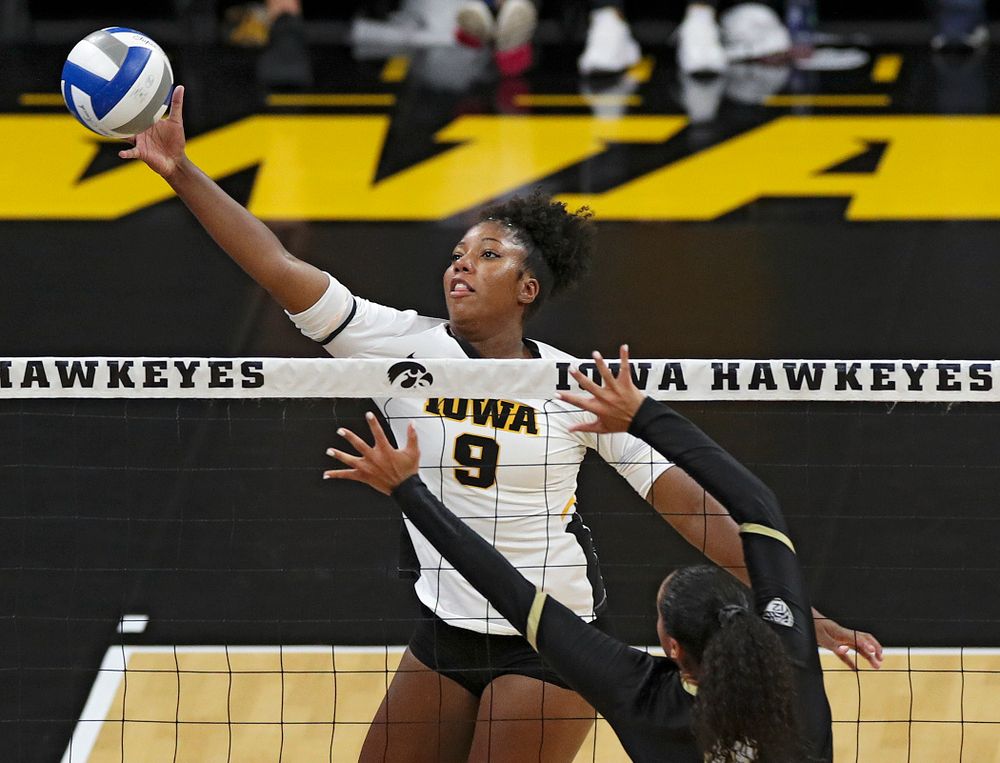 Iowa’s Amiya Jones (9) tips the ball over the net during the second set of their Big Ten/Pac-12 Challenge match against Colorado at Carver-Hawkeye Arena in Iowa City on Friday, Sep 6, 2019. (Stephen Mally/hawkeyesports.com)